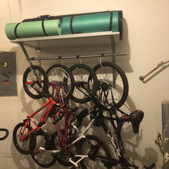 Garaginization - 2ft Shelf, 7ft from the floor, with bike storage. Bike hooks swivel. - Cabinetry Near Me - Las Vegas, Nevada Garaginization - 2ft Shelf, 7ft from the floor, with bike storage. Bike hooks swivel. - Cabinetry Near Me - Las Vegas, Nevada