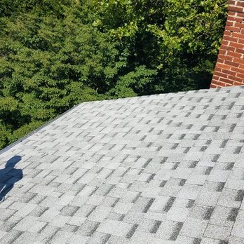 Fanning Construction - the shadow of a person on a roof - General Contractors Near Me