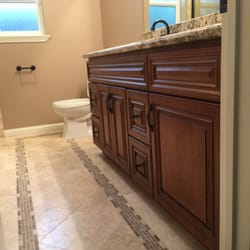 Tile travertine ivory, looks great with maple coffee glaze cabinets!