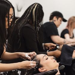 Aveda Institute & Academy Salon - Students shampooing their guests