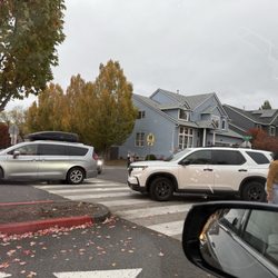 Scholls Heights - This is a cluster. Someone trying to safely cross, cars having to cut in because the traffic IN carline isn't moving forward. What a mess!!!