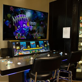RAMS Cafe - a gaming room with a video game on the wall - Gas Stations Near Me - Prince George, Virginia RAMS Cafe - a gaming room with a video game on the wall - Gas Stations Near Me - Prince George, Virginia