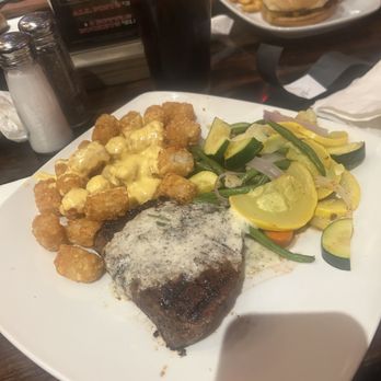 Doc Holliday's Roadhouse - 10 oz. Top sirloin steak cooked med- well cheesy tater tots and sautéed vegetables... - Bars Near Me - Billings, Montana Doc Holliday's Roadhouse - 10 oz. Top sirloin steak cooked med- well cheesy tater tots and sautéed vegetables... - Bars Near Me - Billings, Montana
