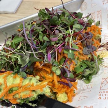 Vibe Organic Kitchen - smashed avocado, probiotic ginger carrots, chives, and micro greens served on sweet potato slices - Juice Bars & Smoothies Near Me - Costa Mesa, California