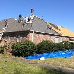 Pitch Perfect Roofing - Crew removing the old shingles.