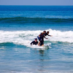 Star - Surf - They are having a blast tandem surfing