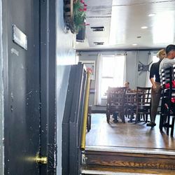 Marthitas Kitchen - Seating area in back. ( stairs )