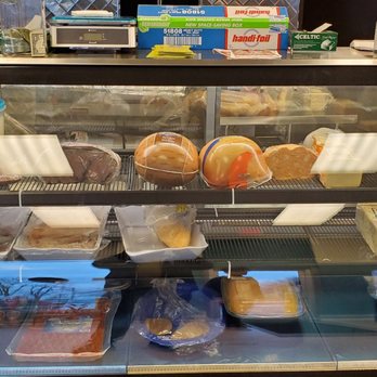 Hahalapenios - a display case filled with food - Mexican Near Me - Buffalo, New York