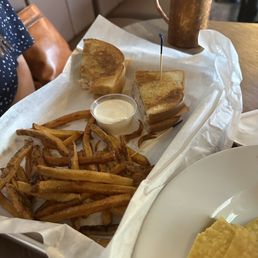 a plate of fries and a sandwich a plate of fries and a sandwich