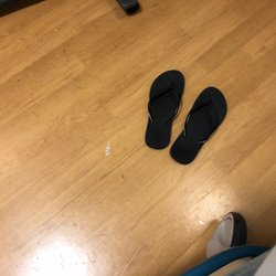 Sutter Capitol Pavilion - Sutters dirty floors with used toothpicks and trash pieces next to my flip flops