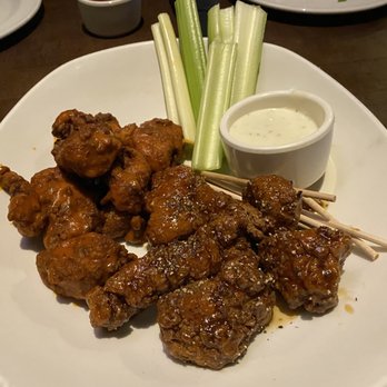 Yard House - Boneless Wings with half Buffalo and half Whiskey Black Pepper sauce - New American Near Me - Austin, Texas