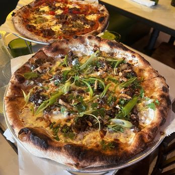 Harry's Pizzeria - Coconut Grove - Mio's Mapo Eggplant Pizza in the front and the Italian Sausage Pizza in the back - Pizza Near Me - Miami, Florida Harry's Pizzeria - Coconut Grove - Mio's Mapo Eggplant Pizza in the front and the Italian Sausage Pizza in the back - Pizza Near Me - Miami, Florida