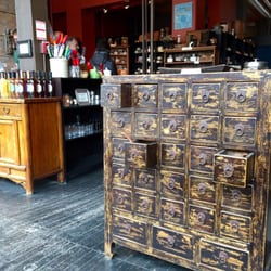 Spices are displayed in antique furniture