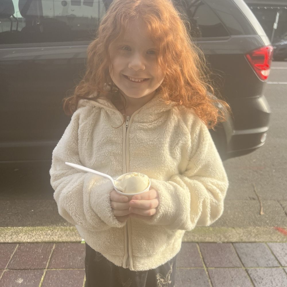 Happy girl with a kid-sized vanilla ice cream! Happy girl with a kid-sized vanilla ice cream!