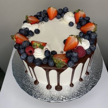 Love and Cake - a chocolate drip cake with strawberries and blueberries - Bakeries Near Me - Chandler, Arizona Love and Cake - a chocolate drip cake with strawberries and blueberries - Bakeries Near Me - Chandler, Arizona