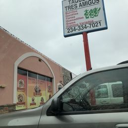 a car parked in front of a store a car parked in front of a store