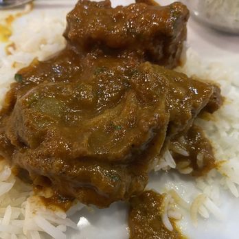 Aroma India - Close-up of the Goat Curry on the rice that comes with. - Indian Near Me - Phoenix, Arizona