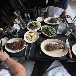 Prime Steak House - Our amazing meal. Bone In Rib Eye, Rib Eye, Macaroni & Cheese, Green Beans Almandine, House Salad