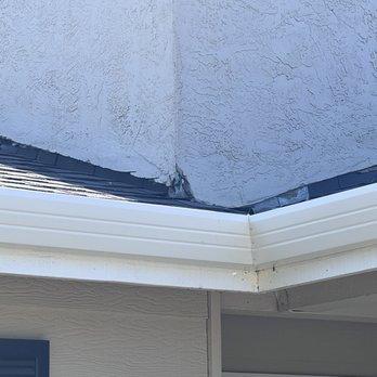 Moran Roofing & Inspection - Large area broken stucco and you can see it was cut by the blade marks. - Roofing Near Me - Livermore, California