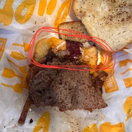 Half of my burger with only half the bread covered with ANYTHING Half of my burger with only half the bread covered with ANYTHING
