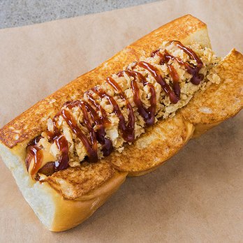 Dog Haus - COWBOY - smoked bacon wrapped dog, cheddar cheese sauce, bbq sauce, crispy onions - New American Near Me - Sandy, Utah