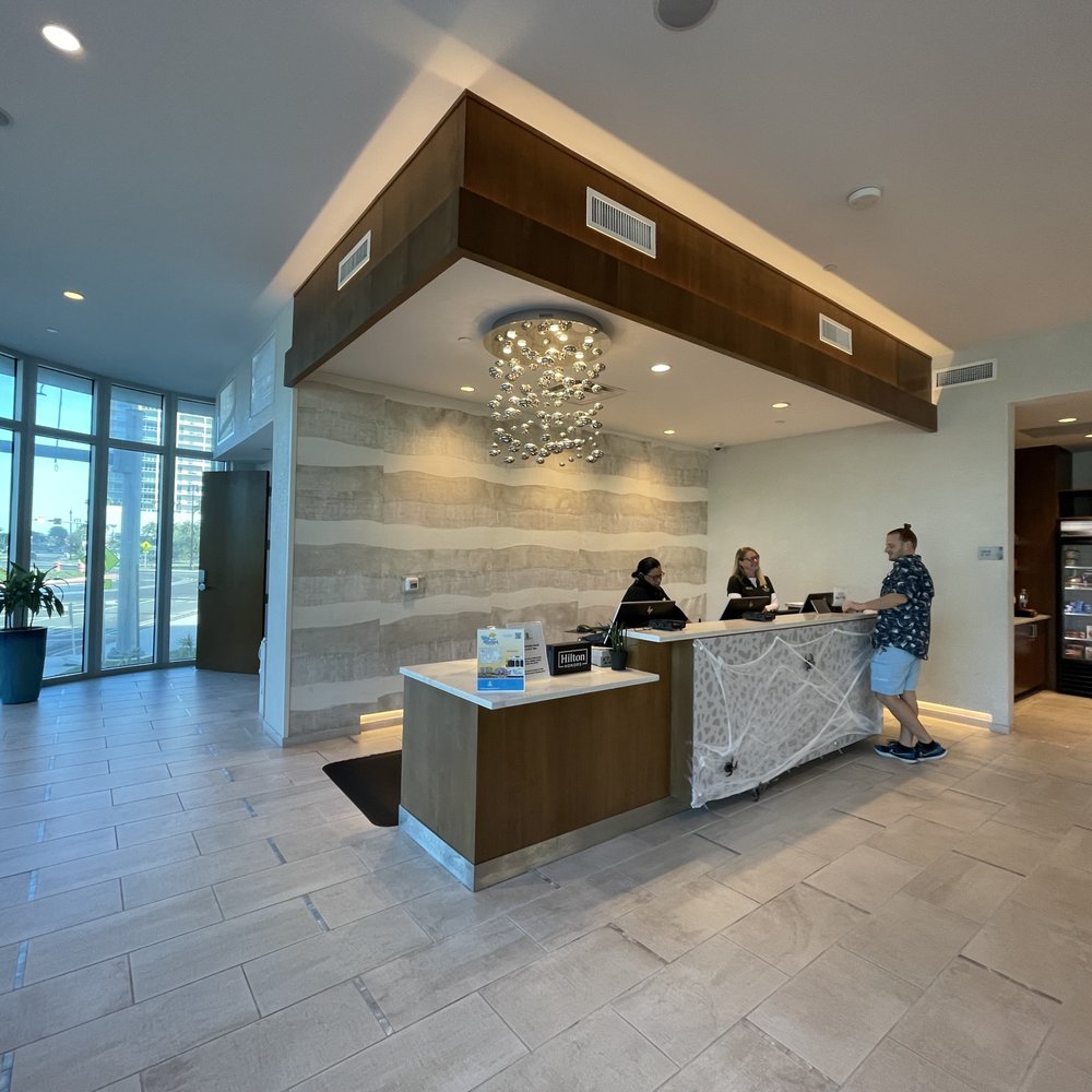 Embassy Suites by Hilton Sarasota - Favorite desk lady on the right talking to my husband. - Hotels Near Me - Sarasota, Florida