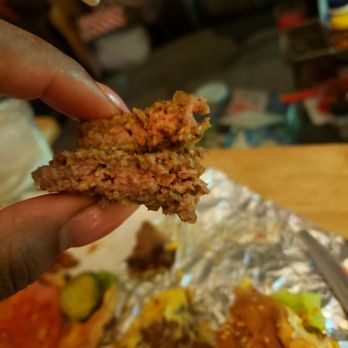 Five Guys - a hand holding a piece of food - Burgers Near Me - Warren, Michigan