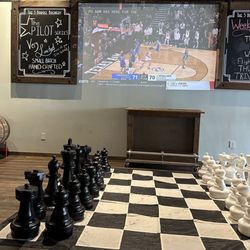 The 5 Barrel - They have many large games, darts and all sorts of board games.