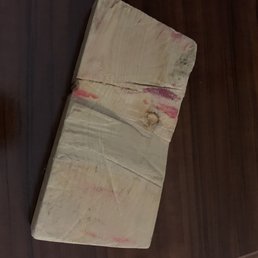 Odd wooden block left in the room.