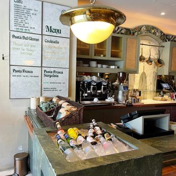 Caffe La Tana - a counter with a variety of drinks - Cafes Near Me - Vancouver, British Columbia Caffe La Tana - a counter with a variety of drinks - Cafes Near Me - Vancouver, British Columbia