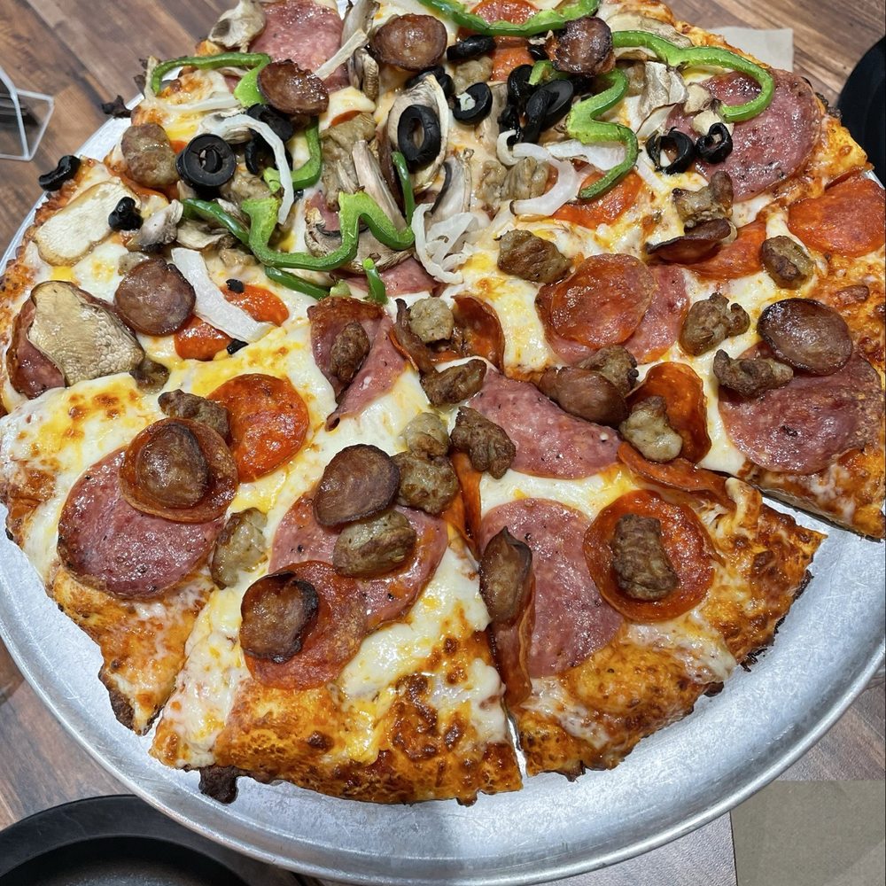 Round Table Pizza - Medium Pizza 1/2 Montague's Marvel All Meat Pizza & 1/2 King Arthur's Pizza. - Pizza Near Me - San Antonio, Texas