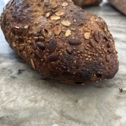 Burned loaf of seeded bread Burned loaf of seeded bread