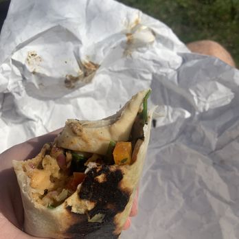 Good Grief - a person holding a burrito in their hand - Sandwiches Near Me - Hudson, Ohio