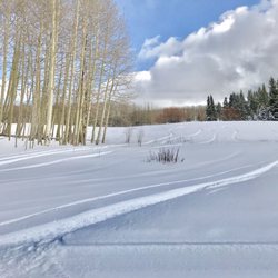 Beaver Creek Nordic Center - Snowboarders jump over the Nordic groomed paths.  Wow.
