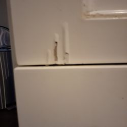 Cabinet Cures of the Triangle - Peeling on island drawer.