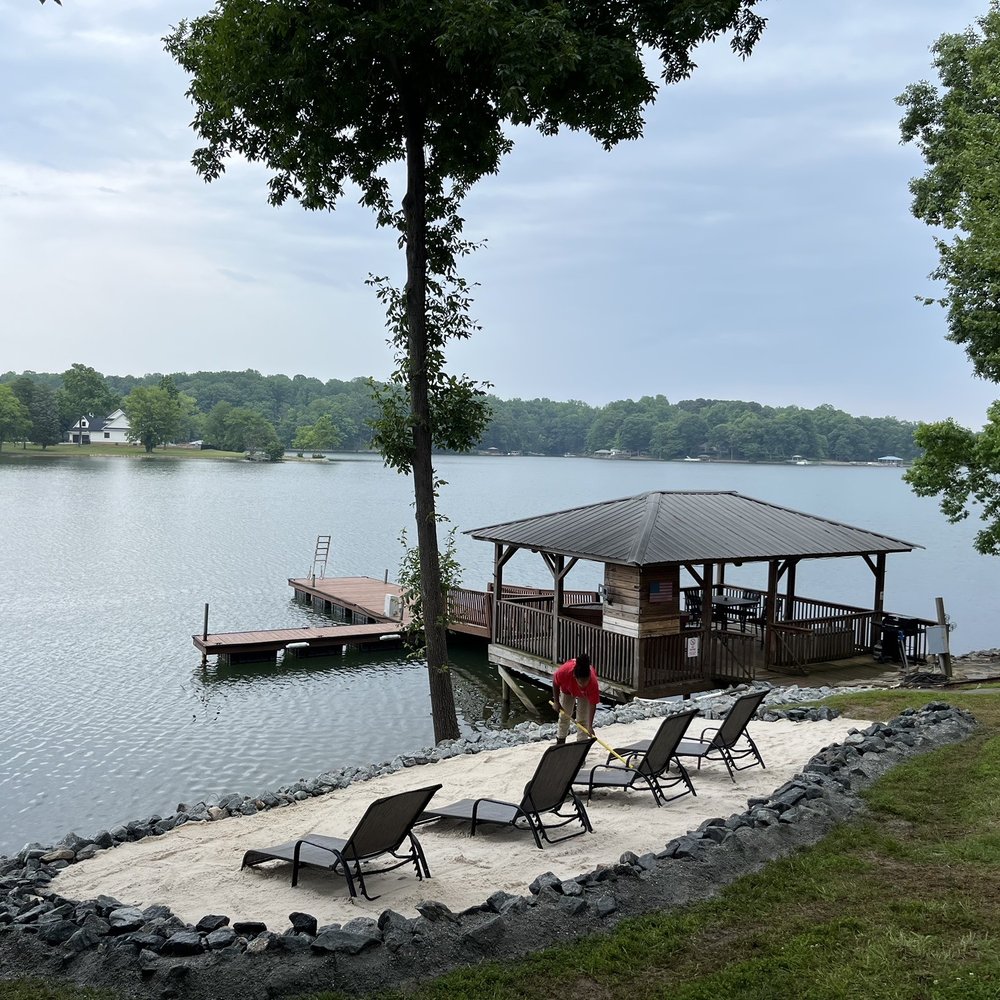 New bloom Landscaping - a gazebo on the shore of a lake - Landscaping Near Me