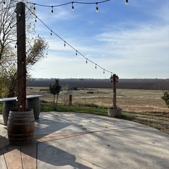 Hanford Ranch Winery - patio with wine barrels and string lights - Venues & Event Spaces Near Me - Galt, California