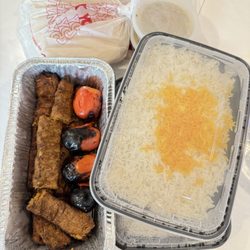 Hatam Restaurant - Two orders of beef Koobideh "family style" to go. Comes with rice, bread, onions, soup, butter, and sumac.
