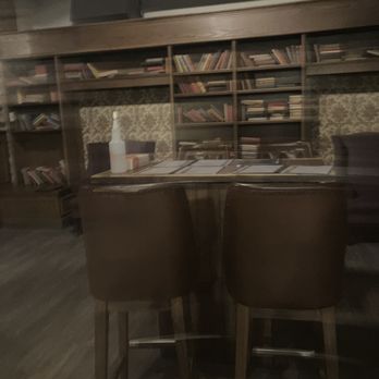 O.Noir -  a blurry image of a table and chairs - Canadian (New) Near Me - Toronto, Ontario