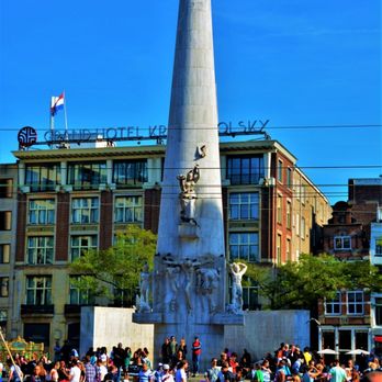 Dam Square - the National Memorial Statue which is dedicated to Dutch soldiers who lost their lives in World War II. - Landmarks & Historical Buildings Near Me - Amsterdam, New Hampshire
