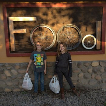 SaltFire Brewing Co Taphouse - two young girls standing in front of a sign - American Near Me - Tempe, Arizona