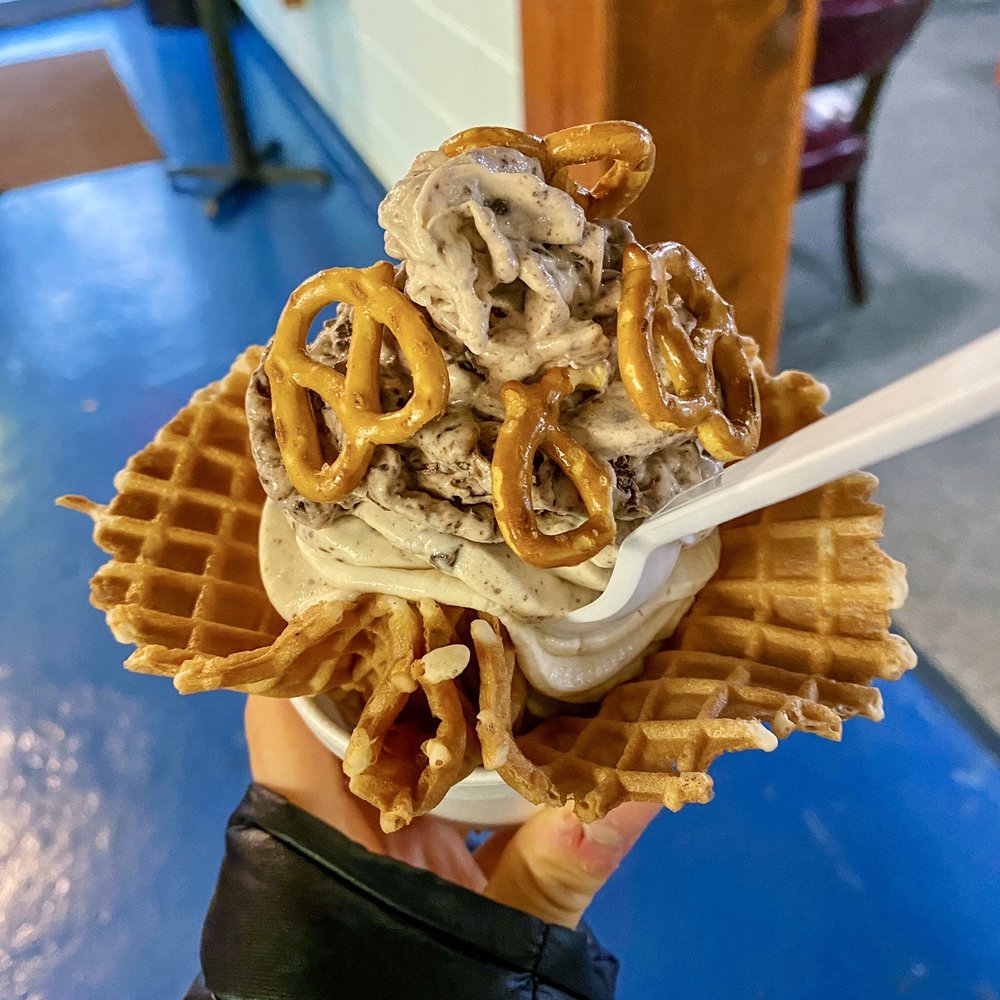 Vanilla Soft Serve blended with bananas and dark chocolate topped with pretzels