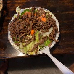 Jimmy's House Of Pizza - Steak salad. As you can see it's FILLED with steak Cucumbers tomatoes, onion and carrots hide underneath.