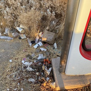 Tesla Supercharger - Weeks and months old trash, and some newer trash too. - EV Charging Stations Near Me - Yuma, Arizona