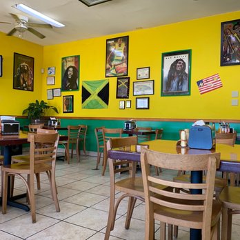 Mercy's Jamaican Kitchen - Wall of fame of sorts, Usain and Bob...nuff said. - Caribbean Near Me - Columbus, Georgia