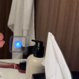 Adjustable lighted mirror in bathroom