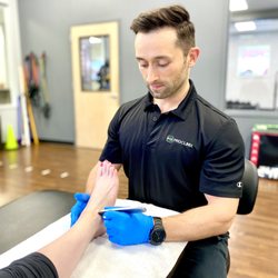 ProClinix Sports Physical Therapy & Chiropractic - Tarrytown NY - ProClinix Armonk Physical Therapist Dr James Cassell using Graston Techniques on peroneal tendonitis