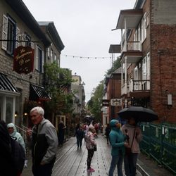 Le Forgeron D'or - Storefront at left on busy Rue du Petit-Champlain.
