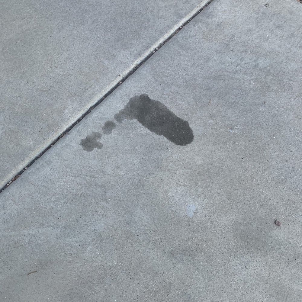 Transmission line leakage on driveway.
