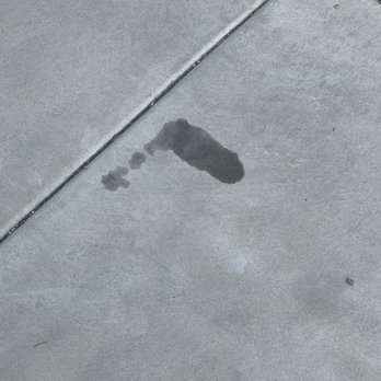 Oasis Auto Center - Gilbert - Transmission line leakage on driveway. - Auto Repair Near Me - Gilbert, Arizona